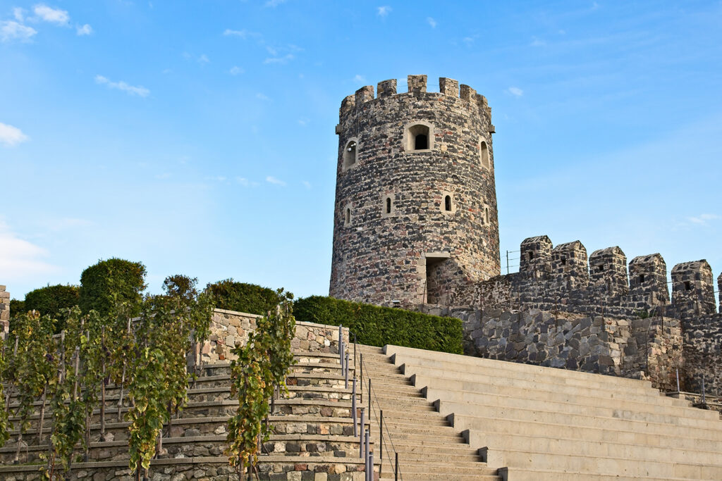 An ancient historic tower touching the clear sky in Georgia